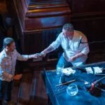 Man giving another man a song request