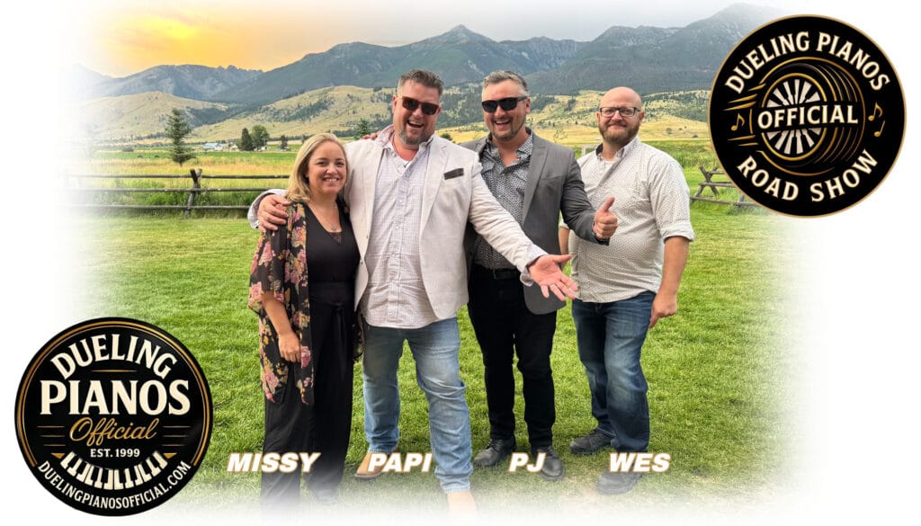 Dueling Pianos Official Road Show team — Missy, Papi, PJ, and Wes — standing in front of the mountains.